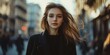 © Valerii Dekhtiarenko - Elegant young woman strolling on an urban street in the fall
