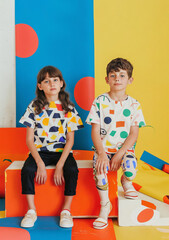 Colorful and stylish kids fashion shoot with vibrant backgrounds