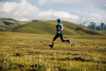 Poster - Fitness woman trail runner running in grassland