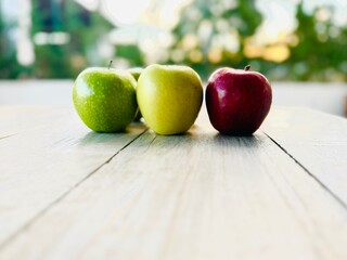 A variety of fresh apples, red, green, and yellow. Healthy eating background.