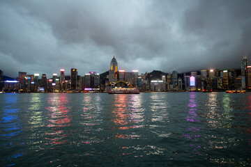 Hong Kong downtown skyline across Victoria harbor at night, Hong Kong, China.