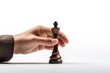 © Rawpixel.com - Chess holding game hand.