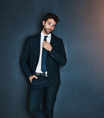 Poster - Portrait, fashion and a corporate business man in studio on a grey background mockup for executive style. Success, professional and a confident young male employee in a suit for formal mock up power