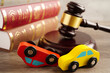 © manassanant - Car accident lawsuit and insurance, Judge hammer with car model.