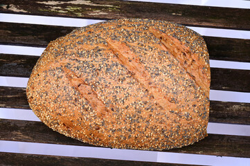 Top view of a world champion bread, multigrain bread, loaf with sesame, poppy and linseed on the crust