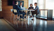 © C.Arcurs/peopleimages.com - Professional, teamwork and conversation with strategy in conference room with manager at office. Discussion, business and group with meeting or brainstorming or planning at company for project.