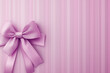 © RafaelDavid - Elegant Pink Ribbon Bow Against a Soft Striped Background, Perfect for Celebrations or Gifts