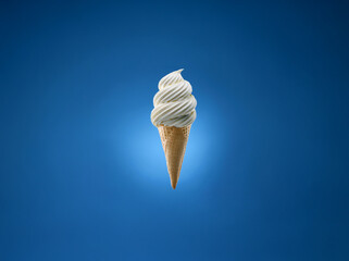 Poster - Soft serve ice cream in a waffle cone, on a blue background.