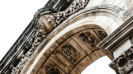 Ancient stone arch isolated on white, featuring ornate stone textures and carvings.