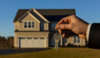 © Arief - Neighbourhood Real Estate - A person holding house keys in front of a modern home, symbolizing homeownership.