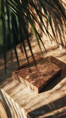 A chic business card rests on a marble surface, bathed in natural light and shadows