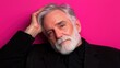 © BOJOShop - Portrait of Mature Man with Gray Hair and Beard on Pink Background