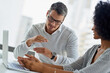 © Arnell Koegelenberg/peopleimages.com - Ideas, teamwork and people with laptop, office and discussion for campaign, collaboration and talking. Digital, man and planning with woman, promotions coordinator and drive sales to company and desk