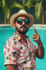 Poster - A person in a hat and sunglasses pointing at an object, with a neutral expression