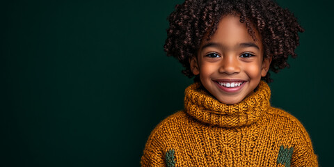 Wall Mural - Black teenager boy on a studio background