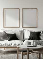 Minimalist living room interior with a white couch. two framed posters. a coffee table. a rug. and natural light