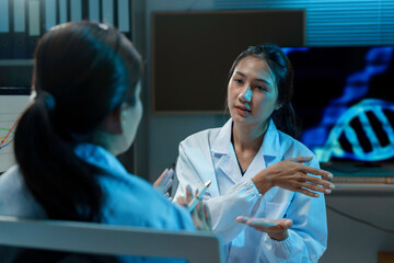 Wall Mural - two scientists are having a discussion about their research in a laboratory, with a dna double helix