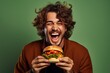 © Rawpixel.com - Biting laughing burger adult.