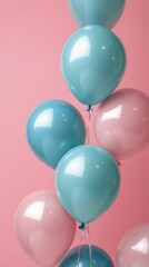 Bright pastel balloons in shades of pink and green against a light pink background