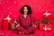 © deagreez - Full body photo of amazed stylish trendy afro american woman gifts xmas cool tradition isolated on red color background