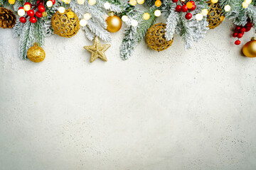 Wall Mural - christmas and new year background with fir branches with gold holiday decorations and pine cones on 