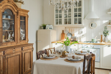 Scandinavian classic minimalistic kitchen with white and wooden details flowers. Modern white kitchen clean contemporary style interior design. Empty bright white interior minimal of kitchen