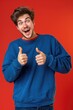 © Vii - A person wearing a blue sweatshirt gives a positive thumbs up, great for motivational or encouraging images