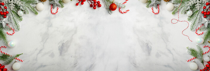Wall Mural - christmas and new year background with fir branches with holiday decorations and pine cones on a mar