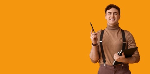 Young journalist with notebook on yellow background with space for text