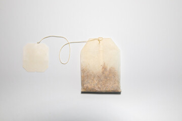 single tea bag flat overhead on white background