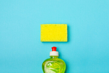 Colorful dish sponges on textured background. Kitchen sponge. Cleaning concept, cleaning service. Dishwashing liquid with clean and dirty dishes plate. Place for text, copy space. Wash the dishes.