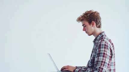 Leinwandbilder - A young man focused on his laptop, working remotely in a minimalistic white background. Generative AI