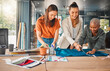 © peopleimages.com - Happy, women and cutting fabric as fashion designer at office with patterns or clothes on project . Startup, employees and creative director with teamwork, collaboration or coworking as stylist