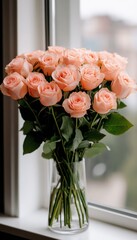 Canvas Print - A bouquet of peach roses arranged in a glass vase by a window.