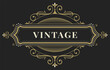 © Elena - Ornate vintage frame with decorative curls. Gold stamping effect on dark background.Used for wedding invitations, certificates, labels, greeting cards, menus, brochures and flyers.Vector illustration.