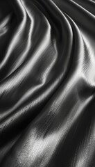 Poster - Soft, luxurious black satin fabric cascades in gentle, flowing folds. The smooth texture catches light, creating subtle reflections and enhancing its rich, elegant appearance.