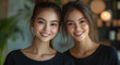 © LK  - Two Thai attractive masseuses stand in a bright minimalist Thai massage parlor wearing black shirts, smiling welcomingly. Thai massage concept. .