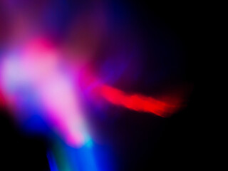 Wall Mural - a colorful, blurry background with a rainbow of colors. the colors are bright and vibrant, creating 