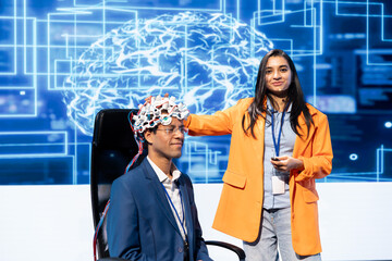 Poster - Smiling neuroscientists talking at AI convention, sharing neural implants industry insights to audience. Upbeat tech startup employees at tech event presenting latest AI EEG headsets