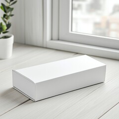 Minimal white box on wooden table by window in bright natural light