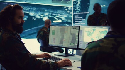 Poster - Reconnaissance department operator gathering information crucial for a national safety mission, transmitting intelligence to the troops. Telecommunications personnel in command post. Camera B.