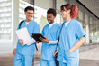 © ADDICTIVE STOCK - Nurse students discussing coursework outside campus