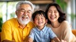 © LifeMedia - A joyful elderly man with a family grandson. Warmth and happiness radiate as they sit close, enjoying a moment together in a bright, inviting space.