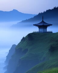 Wall Mural - Misty landscape with a pagoda on a cliff overlooking the ocean.