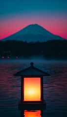 Wall Mural - Serene landscape featuring a lantern by a lake with a mountain backdrop.