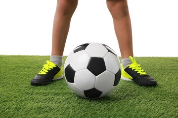 Wall Mural - Football player with soccer ball on artificial grass against white background, closeup