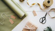 © Morninghead - Gift preparation station with wrapping paper, scissors, and tags