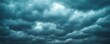 © Jiraporn - Dark stormy clouds filling the sky, creating an ominous and dramatic atmosphere.