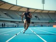 © Derek Brumby - Athlete Sprinting on a Blue Track in an Outdoor Stadium