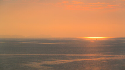 Wall Mural - beautiful view of golden sea and sky in the evening, natural background